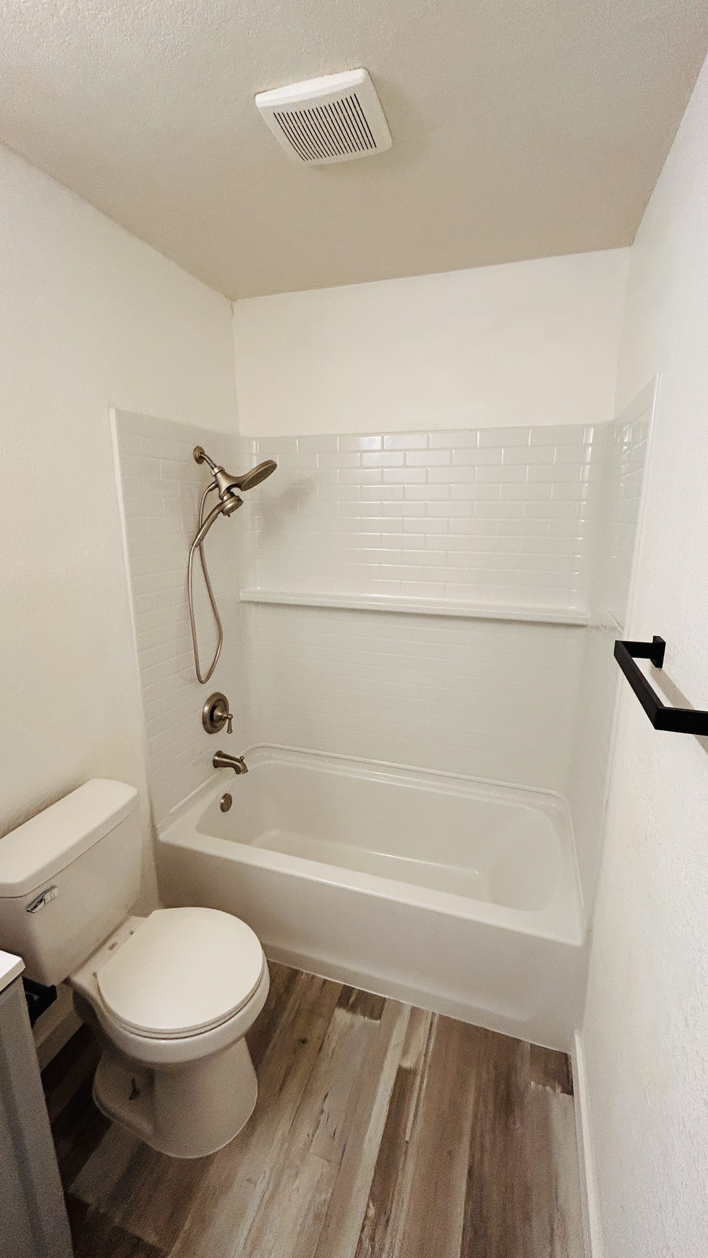Bathroom after remodel — new shower and tub