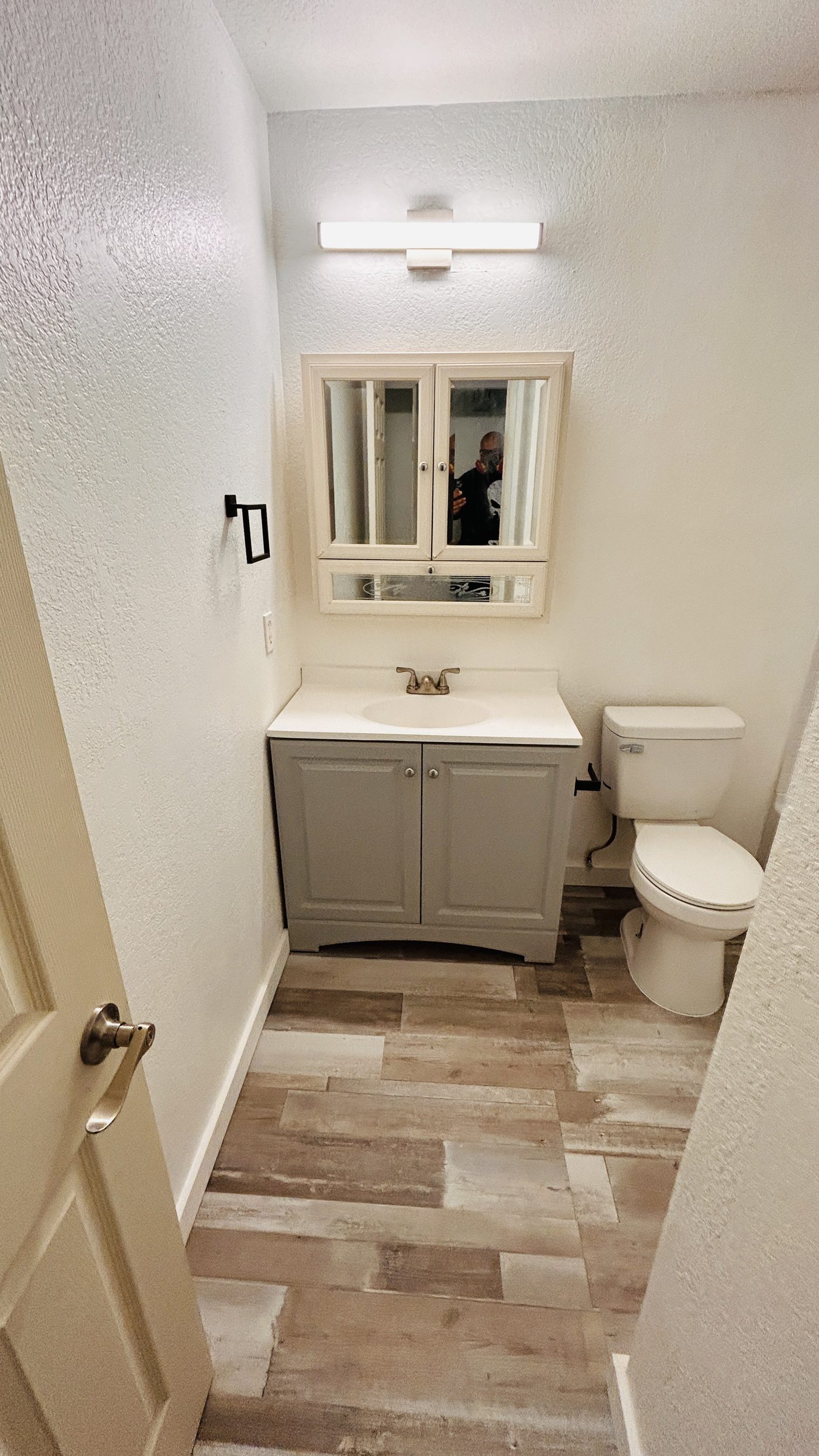 Bathroom after remodel — vanity and flooring