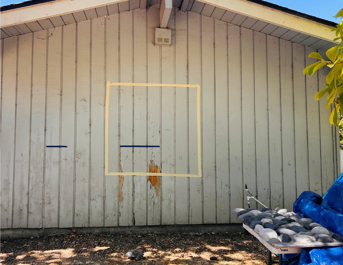 Exterior before — old vertical siding